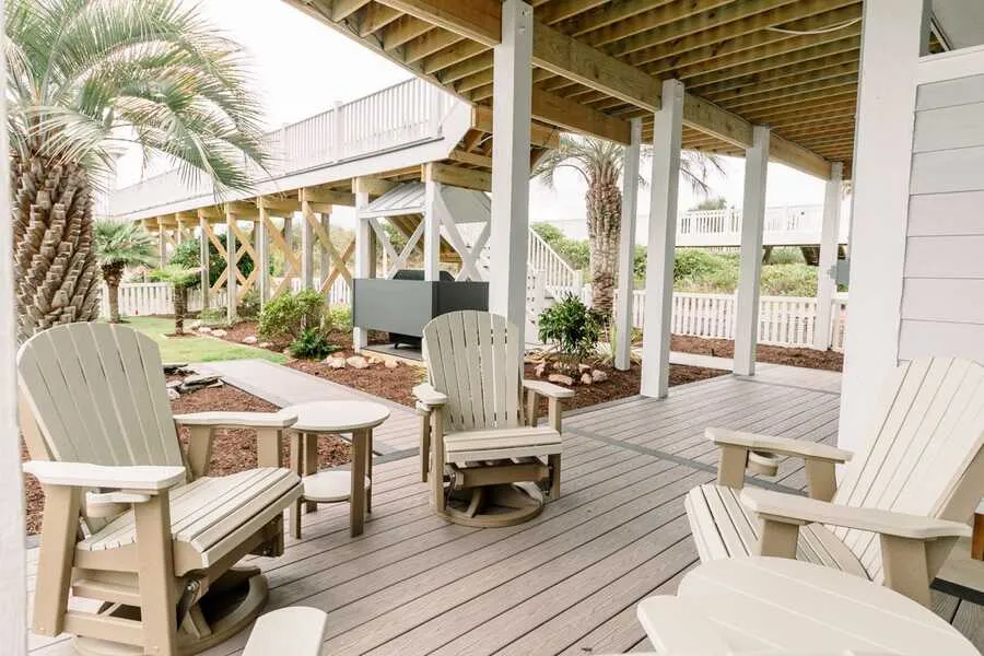 Covered ground deck with Adirondack chairs