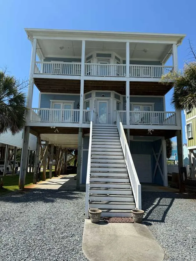 Three-story raised home with long stair
