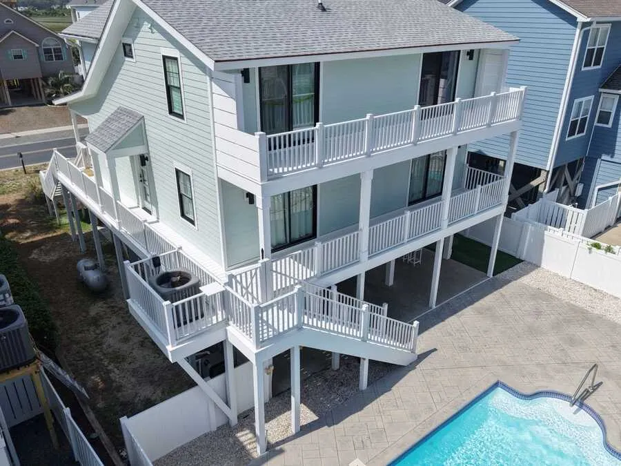 Pool beside a raised beach house