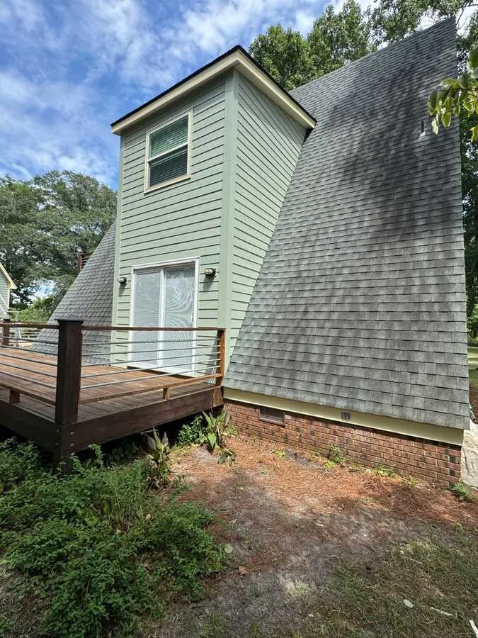 New siding on a gable with deck below